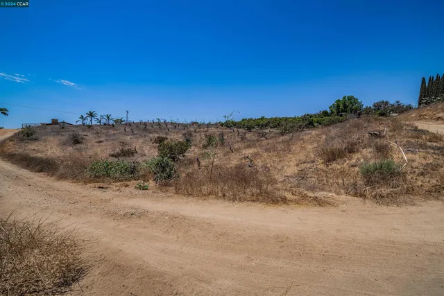 a view of a large building with a beach