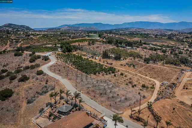 an aerial view of residential house with parking space
