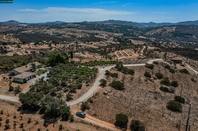 an aerial view of house with yard