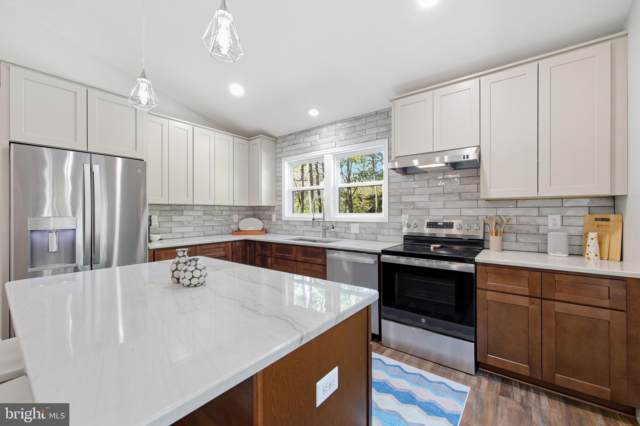 395 Deloris Road Mount Jackson, VA 22842 - Photo 14 of 48 a kitchen with stainless steel appliances granite countertop a sink stove and refrigerator