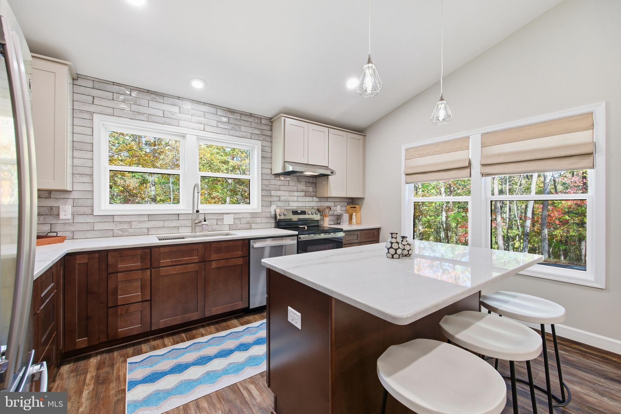395 Deloris Road Mount Jackson, VA 22842 - Photo 15 of 48 a kitchen with a stove a sink and a refrigerator