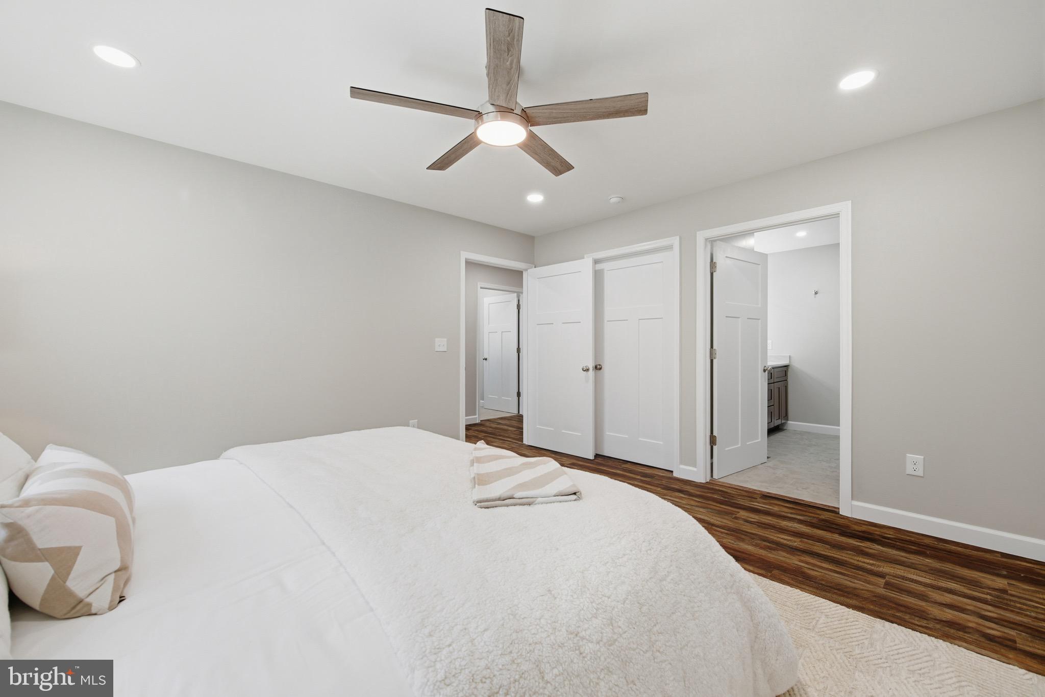 395 Deloris Road Mount Jackson, VA 22842 - Photo 22 of 48 a bedroom with a bed and a chandelier