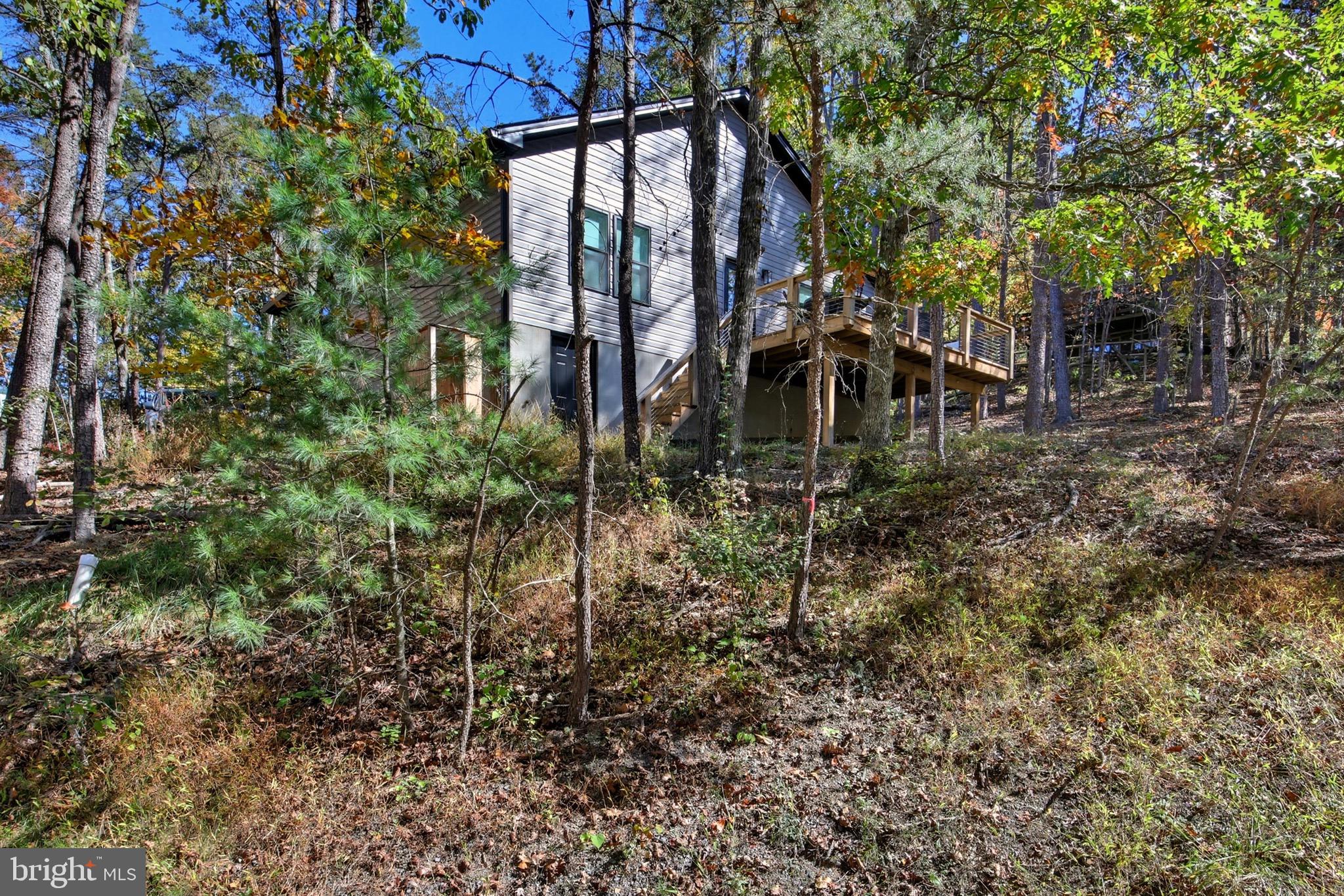 395 Deloris Road Mount Jackson, VA 22842 - Photo 35 of 48 a backyard of a house with table and chairs
