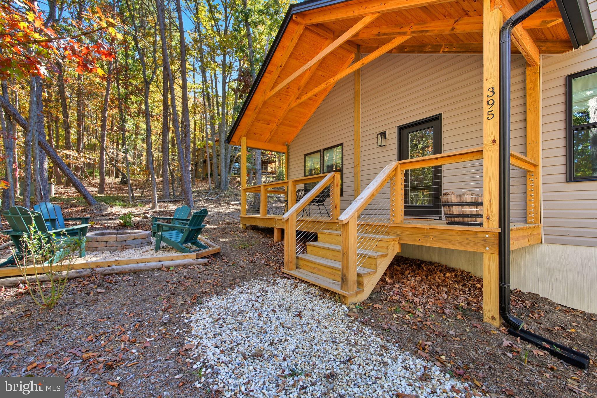 395 Deloris Road Mount Jackson, VA 22842 - Photo 37 of 48 a backyard of a house with barbeque oven table and chairs