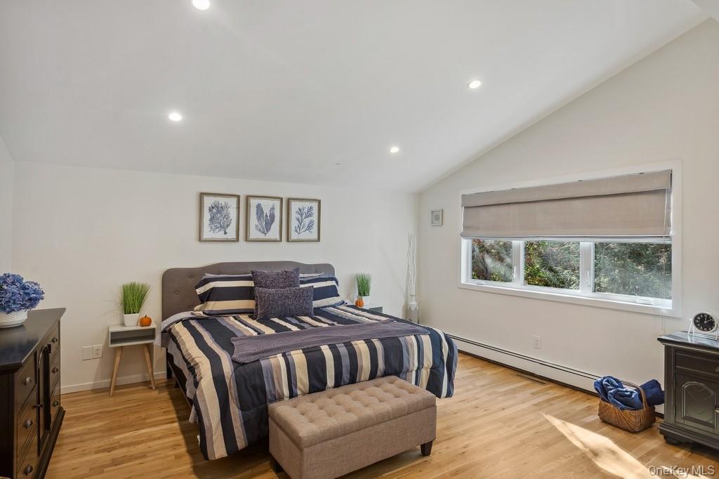 18 Park Circle Quogue, NY 11959 - Photo 13 of 25 a bedroom with furniture and a window