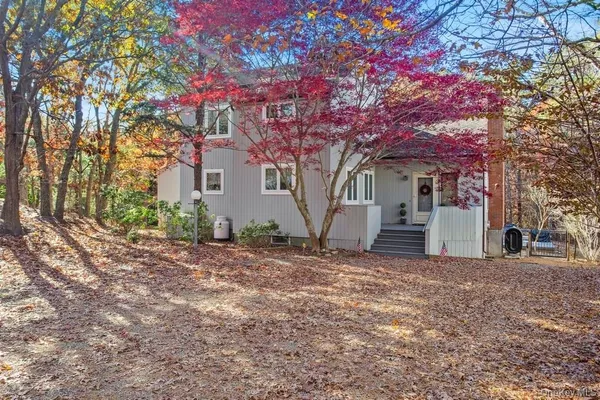 a house with a tree in front of it