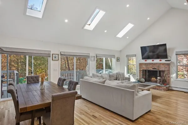a living room with fireplace furniture and a flat screen tv