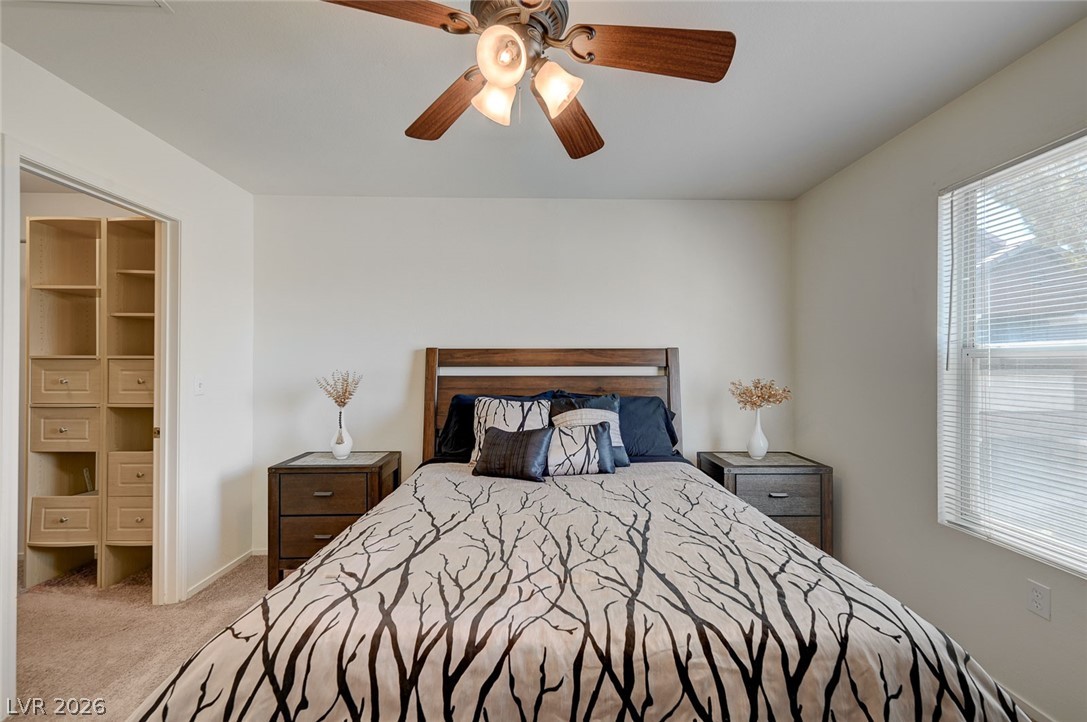 555 East Silverado Ranch Boulevard, Unit 2124 Las Vegas, NV 89183 - Photo 27 of 47 A restful bedroom offers a custom walk-in closet for organized storage.