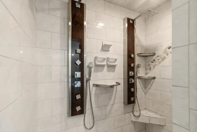a bathroom with a glass shower door