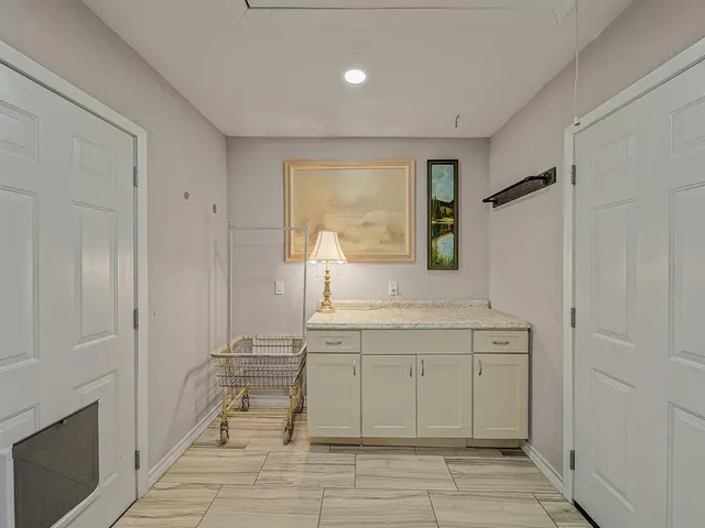 a spacious bathroom with a shower sink and mirror