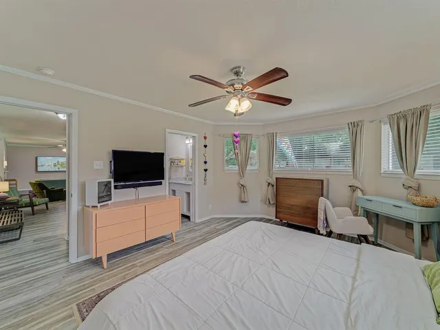 a view of a livingroom with furniture and a flat screen tv