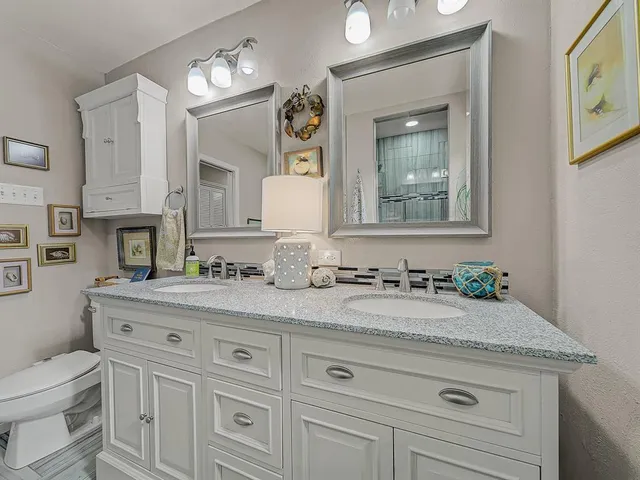a bathroom with a sink a vanity and a mirror