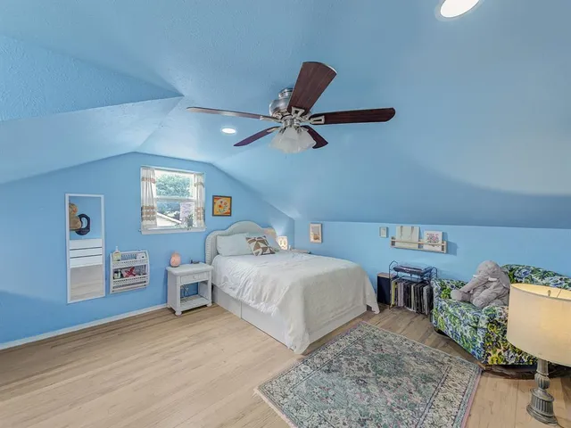 a bedroom with a bed and dresser