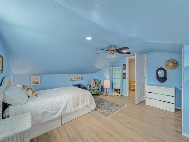 a bedroom with a bed and a cabinets