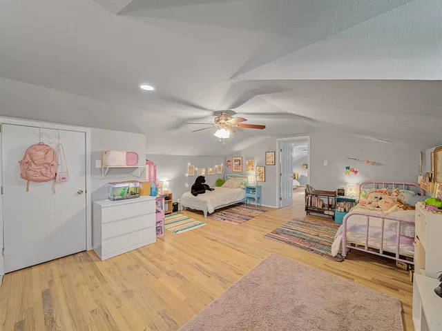 a bedroom with furniture and a chandelier