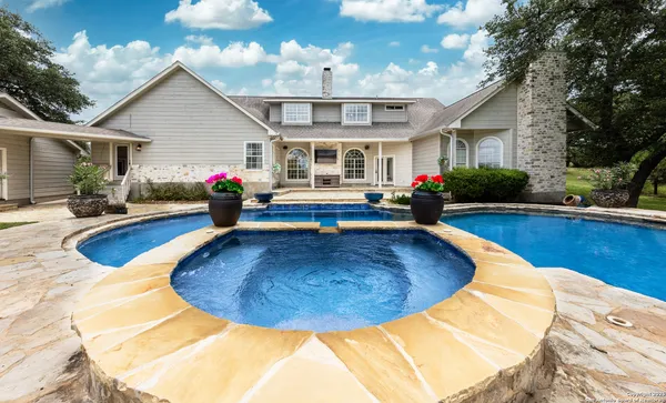 a view of a house with swimming pool