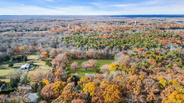 an aerial view of residential house with beach and lake view
