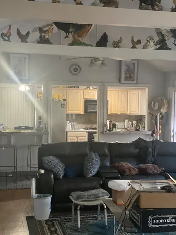 a living room with furniture and window