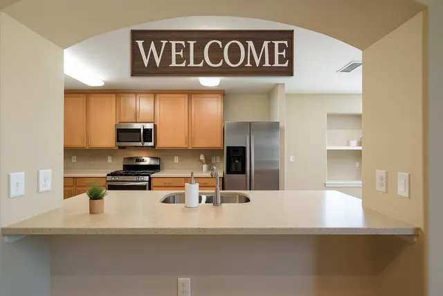 a view of kitchen view of refrigerator and window