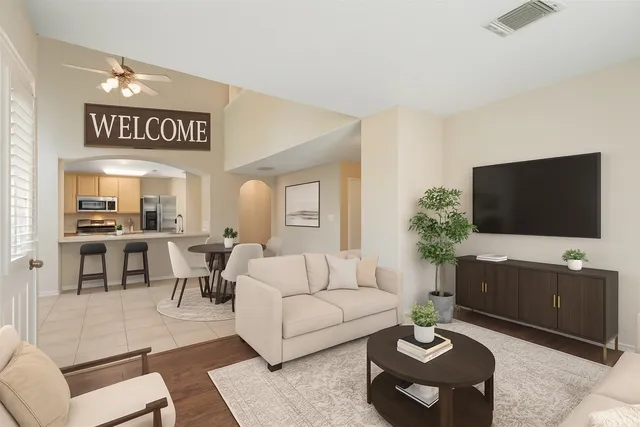 a living room with furniture and a flat screen tv
