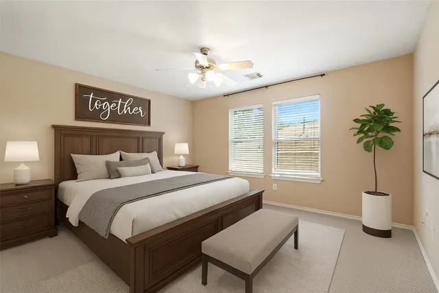 a bedroom with bed and a window