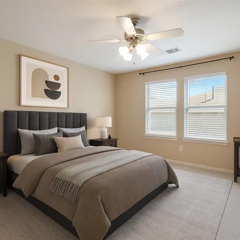 a bedroom with a large bed and a window