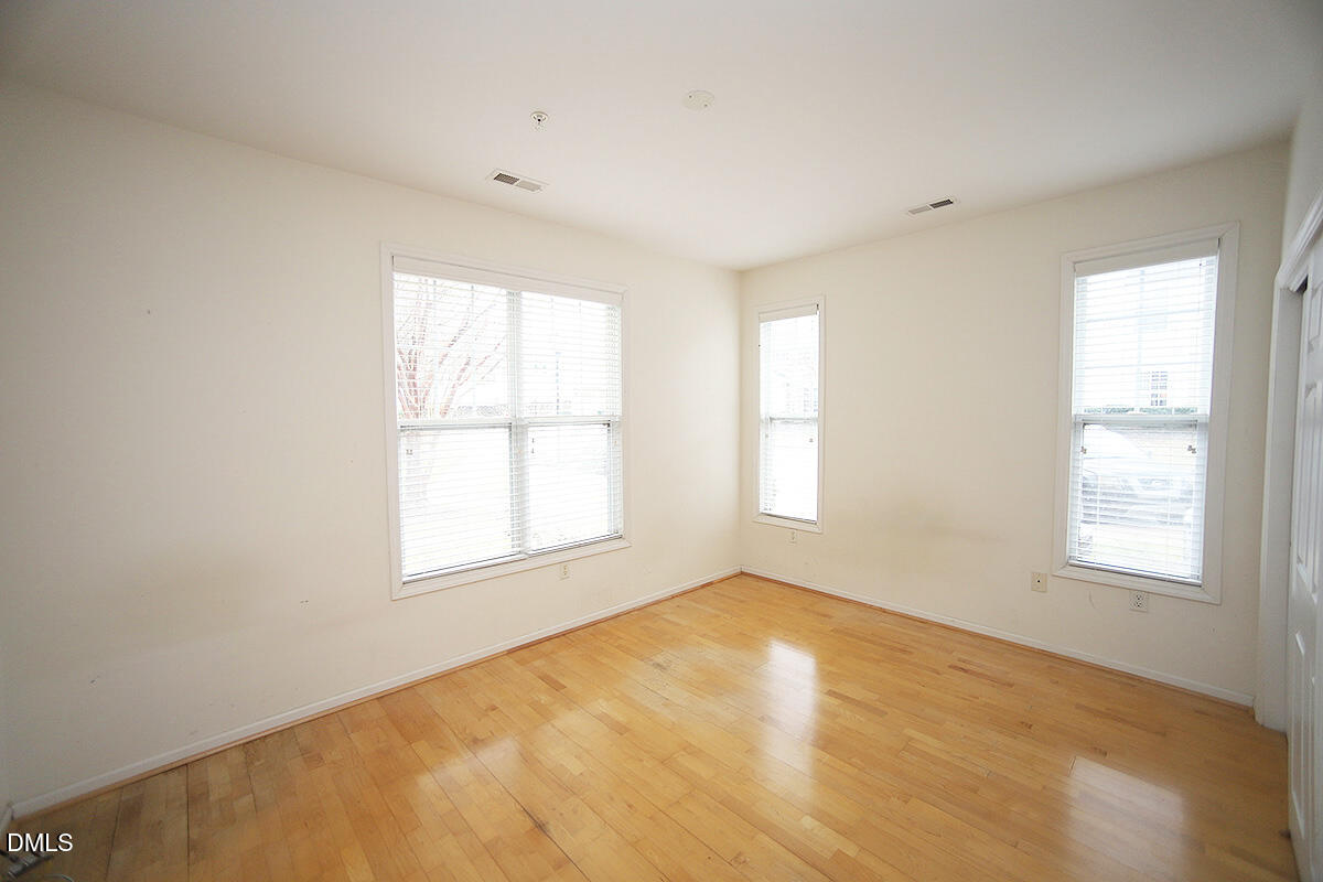 3161 Hemlock Forest Circle, Unit 101 Raleigh, NC 27612 - Photo 17 of 21 a view of an empty room with a window