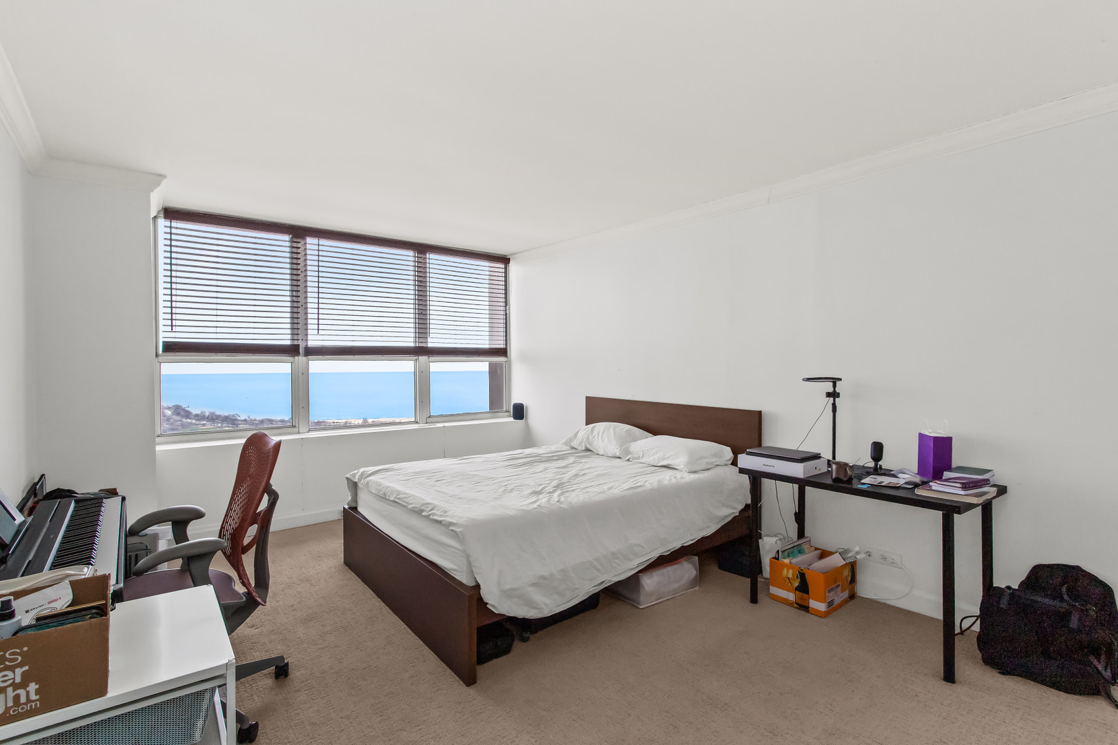 Undisclosed Address Chicago, IL 60613 - Photo 13 of 16 a bedroom with furniture and a window