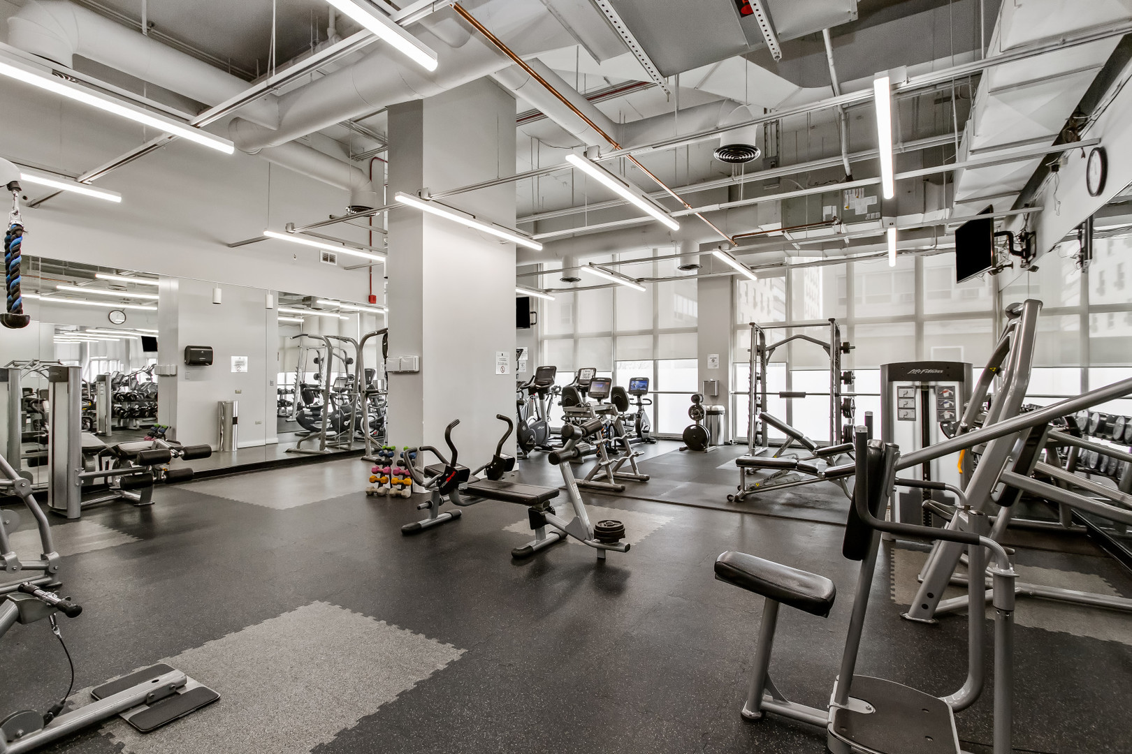 Undisclosed Address Chicago, IL 60613 - Photo 3 of 16 a view of a room with gym equipment