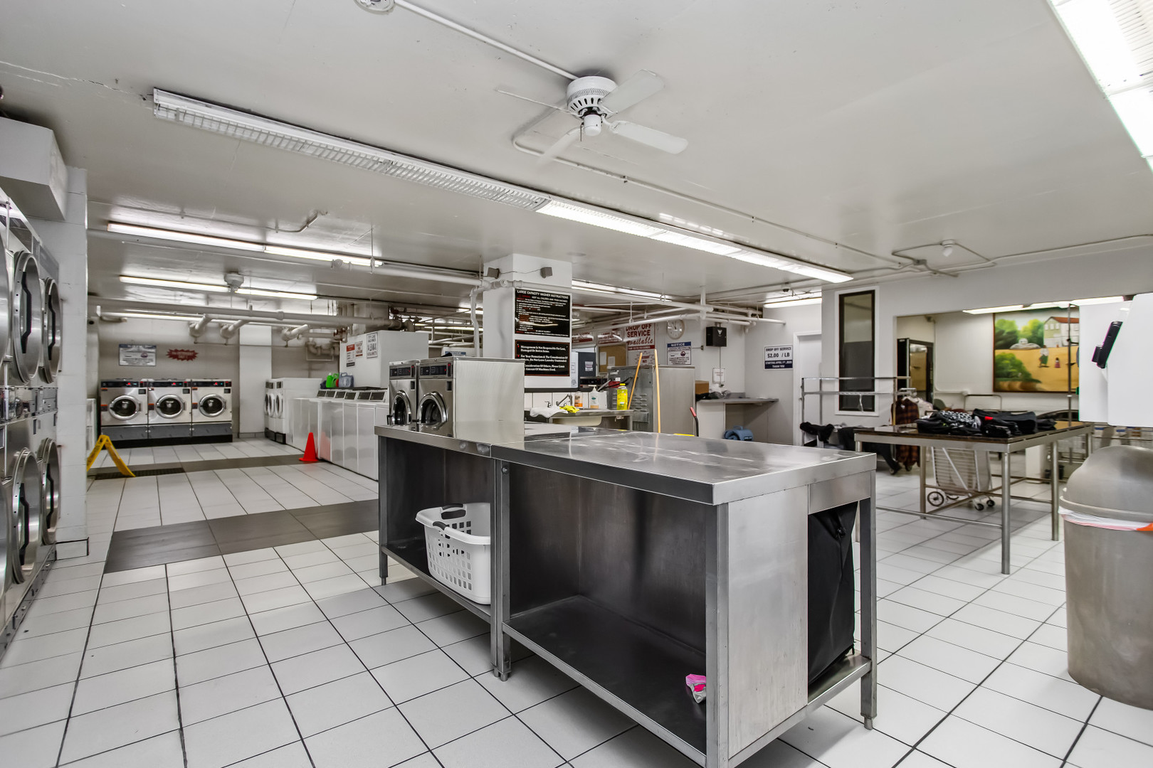 Undisclosed Address Chicago, IL 60613 - Photo 4 of 16 a kitchen with stainless steel appliances granite countertop a stove and a refrigerator