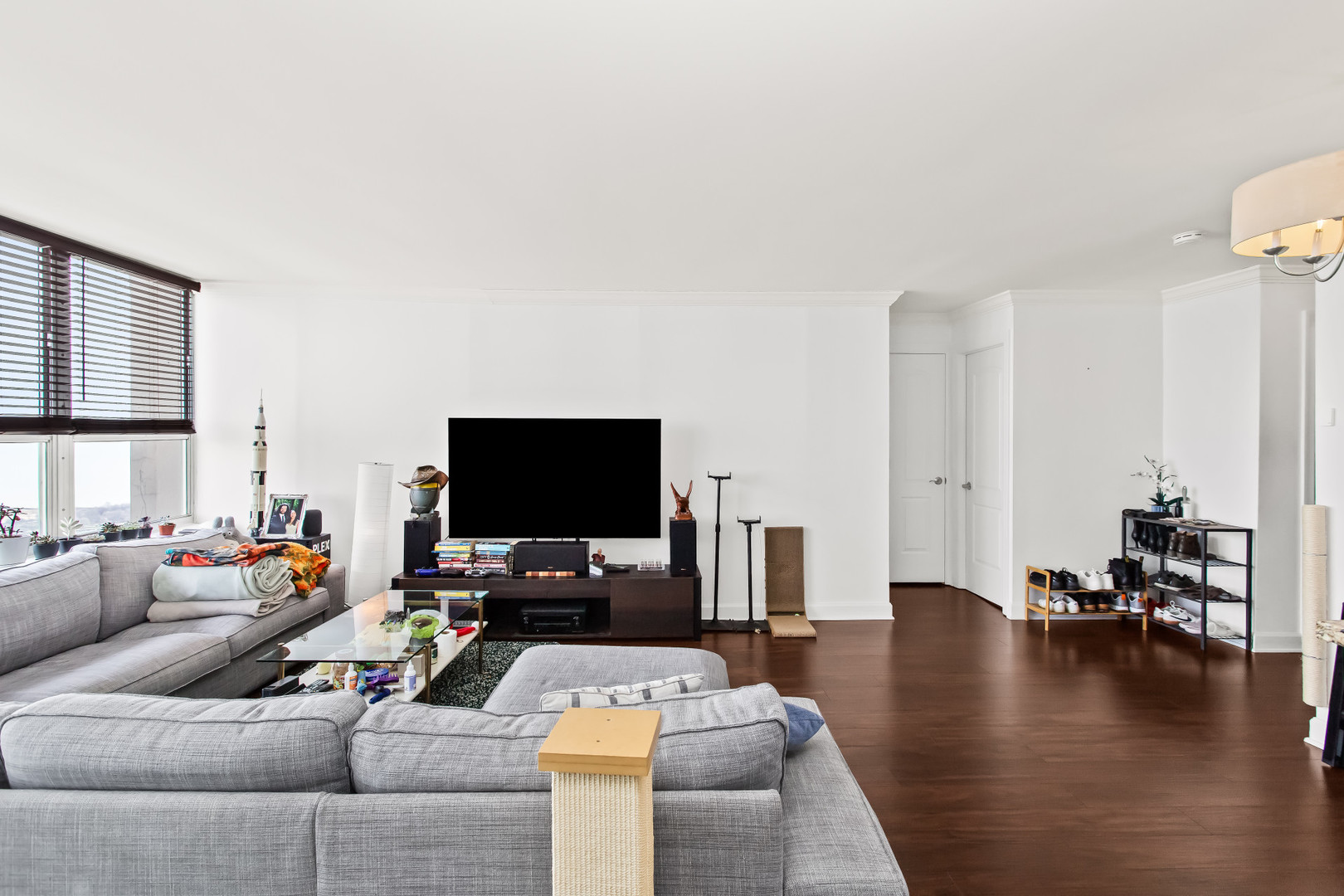 Undisclosed Address Chicago, IL 60613 - Photo 7 of 16 a living room with furniture and a flat screen tv