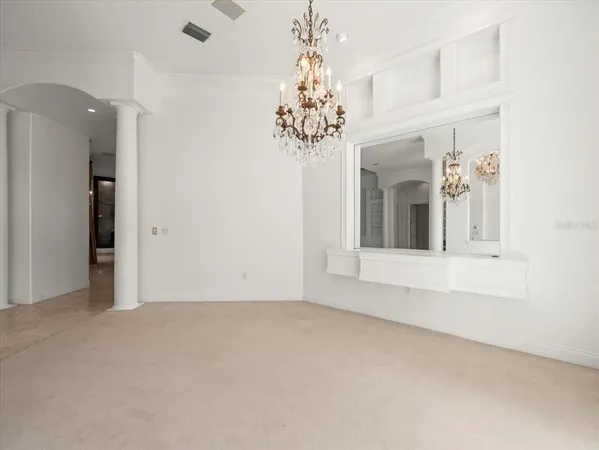 a view of a room with window and cabinet