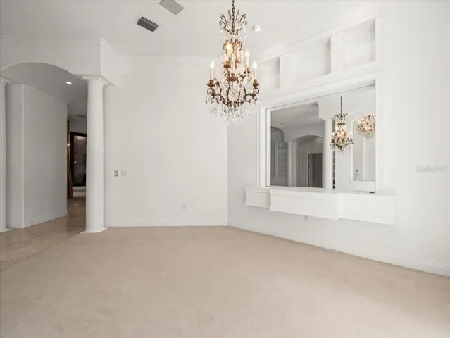 a view of a room with window and cabinet