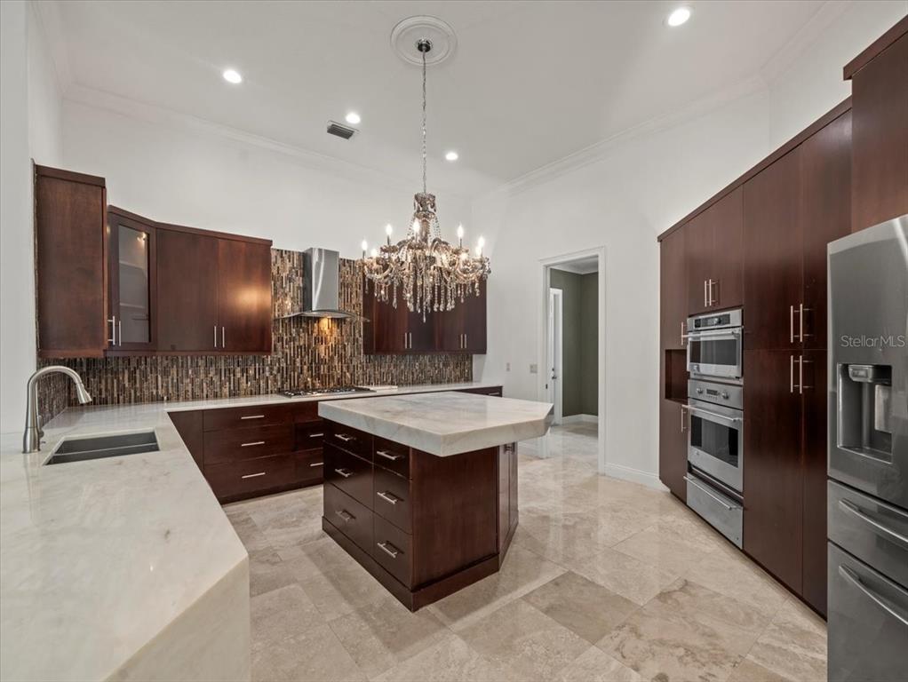4529 Cheval Boulevard Lutz, FL 33558 - Photo 21 of 83 a kitchen with a sink stove and refrigerator