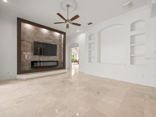 a view of empty room with ceiling fan