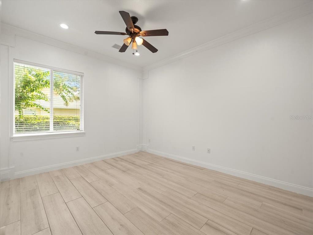 4529 Cheval Boulevard Lutz, FL 33558 - Photo 57 of 83 an empty room with a window and a fan