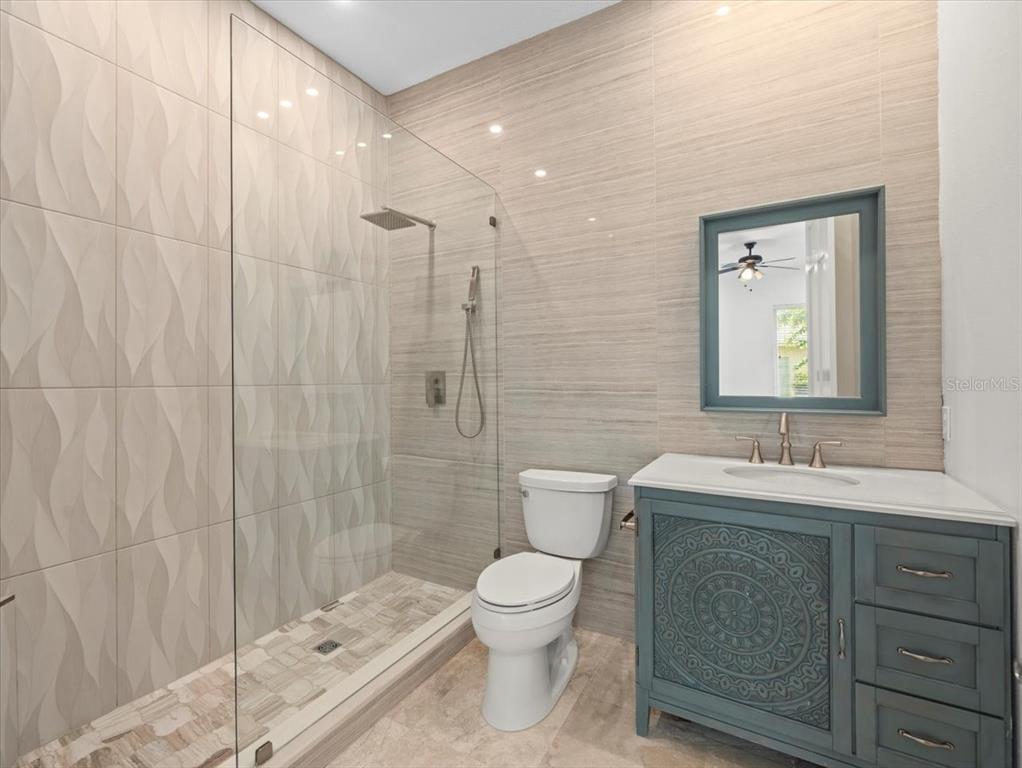 4529 Cheval Boulevard Lutz, FL 33558 - Photo 59 of 83 a bathroom with a toilet sink and mirror