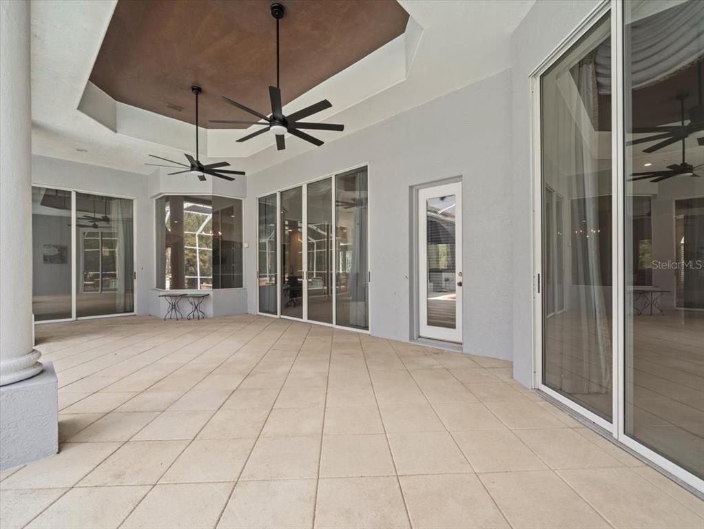 4529 Cheval Boulevard Lutz, FL 33558 - Photo 63 of 83 a view of an empty room with a glass door