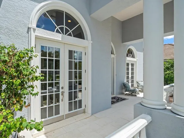 a view of an empty room and a kitchen with furniture kitchen wooden floor and windows