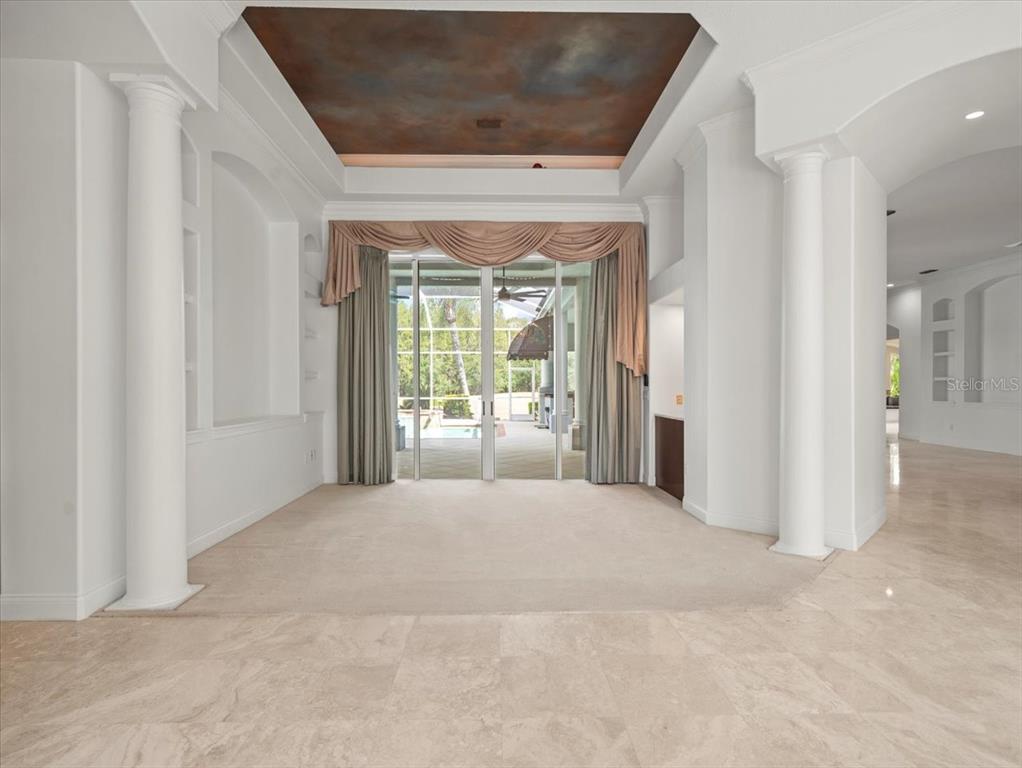 4529 Cheval Boulevard Lutz, FL 33558 - Photo 10 of 83 a view of a hallway with wooden floor and a livingroom