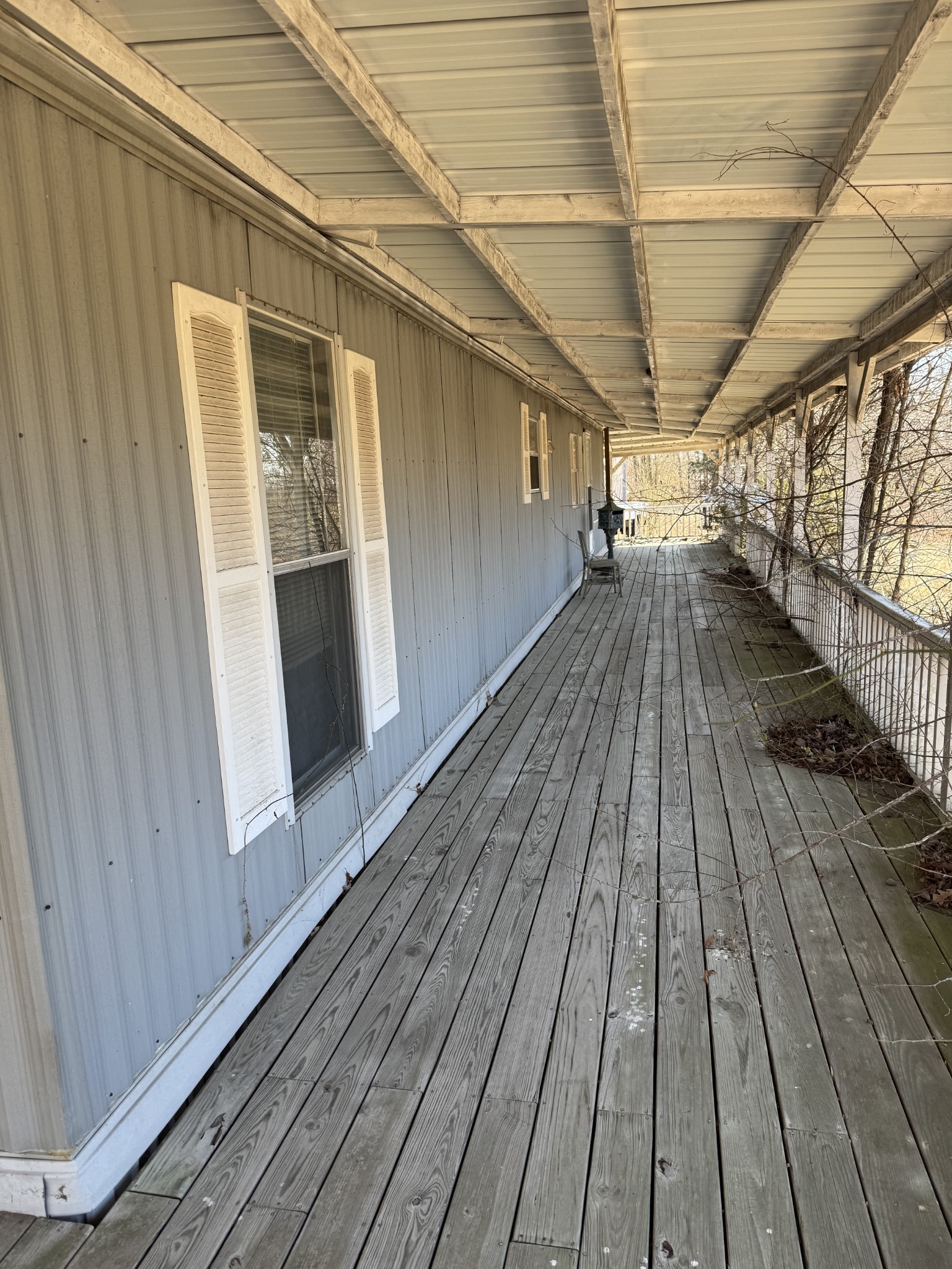 1475 Holland Road Lafayette, TN 37083 - Photo 3 of 12 a view of balcony with wooden floor