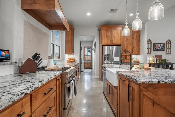 a kitchen with lots of counter space and a sink