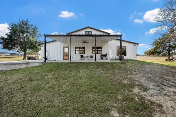 a front view of a house with a yard and porch