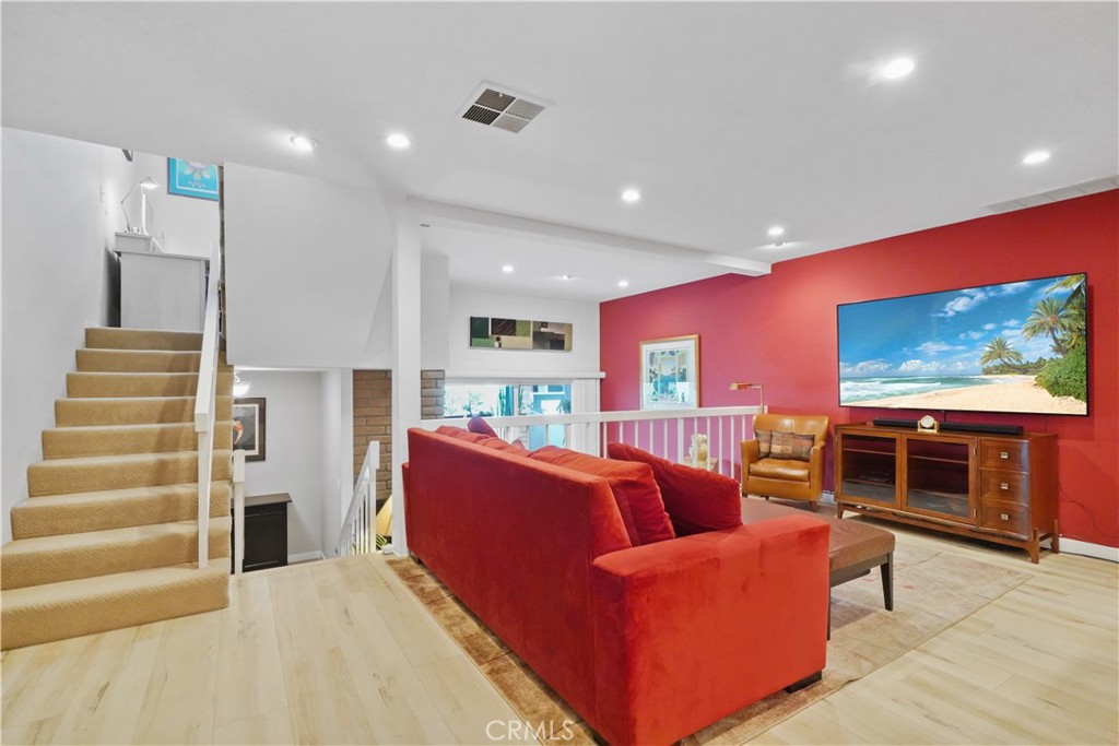 11912 Riverside Drive, Unit 19 Valley Village, CA 91607 - Photo 1 of 1 a living room with furniture and a flat screen tv