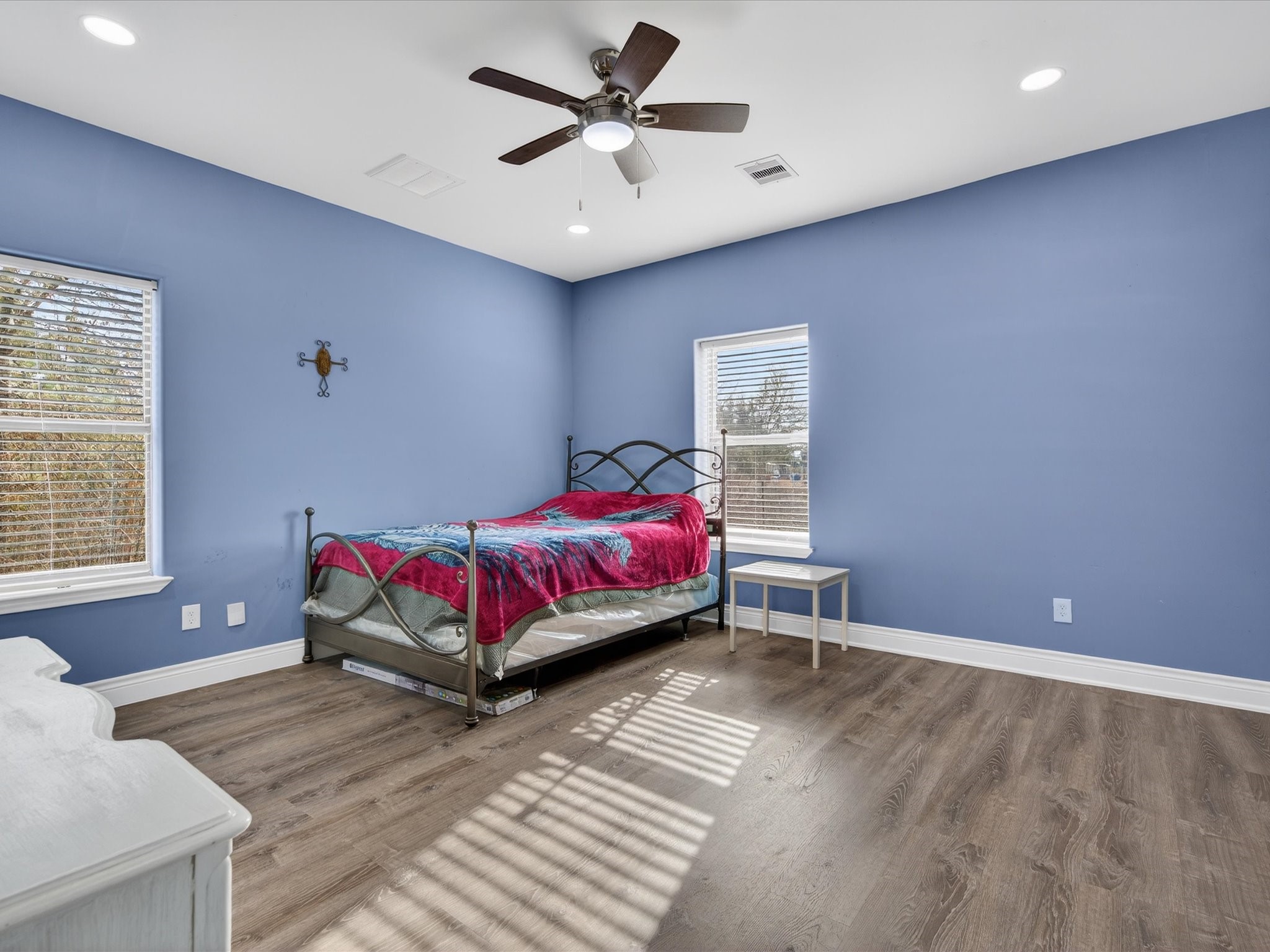 1833 County Road 3556 Cleveland, TX 77327 - Photo 13 of 30 a bedroom with a bed and a chandelier