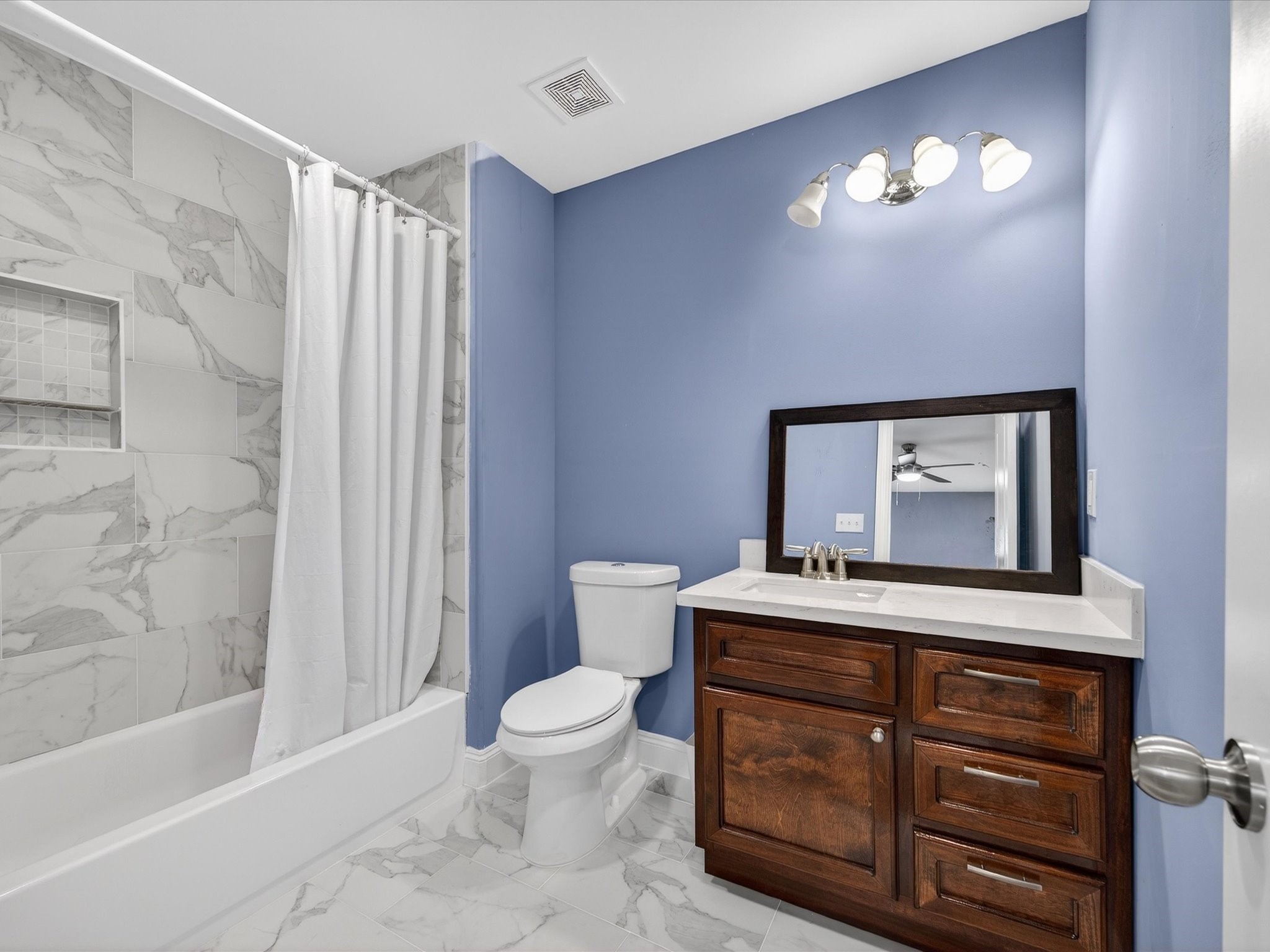 1833 County Road 3556 Cleveland, TX 77327 - Photo 20 of 30 a bathroom with a sink a toilet and a bathtub