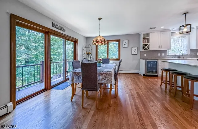 a dining room with furniture window wooden floor