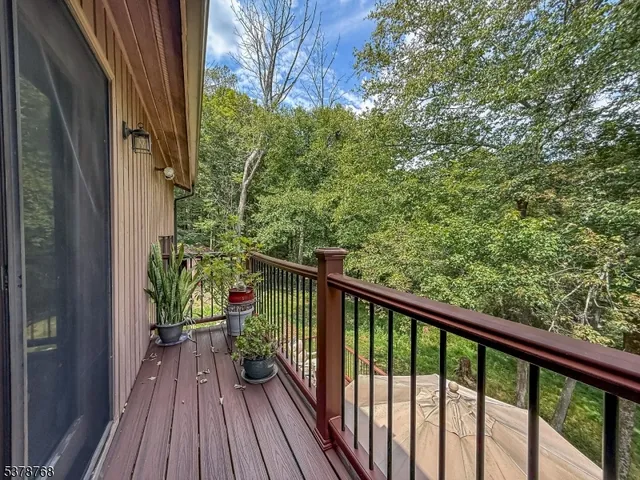 a view of a balcony with wooden floor