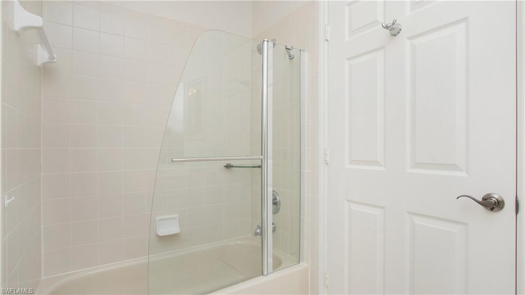 5705 Heron Lane, Unit 801 Naples, FL 34110 - Photo 15 of 32 a bathroom with a shower
