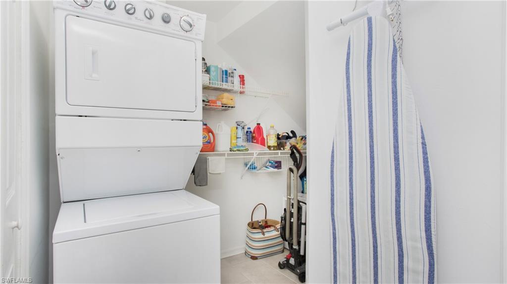 5705 Heron Lane, Unit 801 Naples, FL 34110 - Photo 16 of 32 a utility room with dryer and washer
